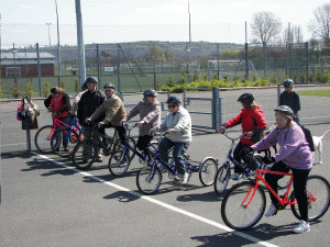 Picture of the Cycling group linig up for their session