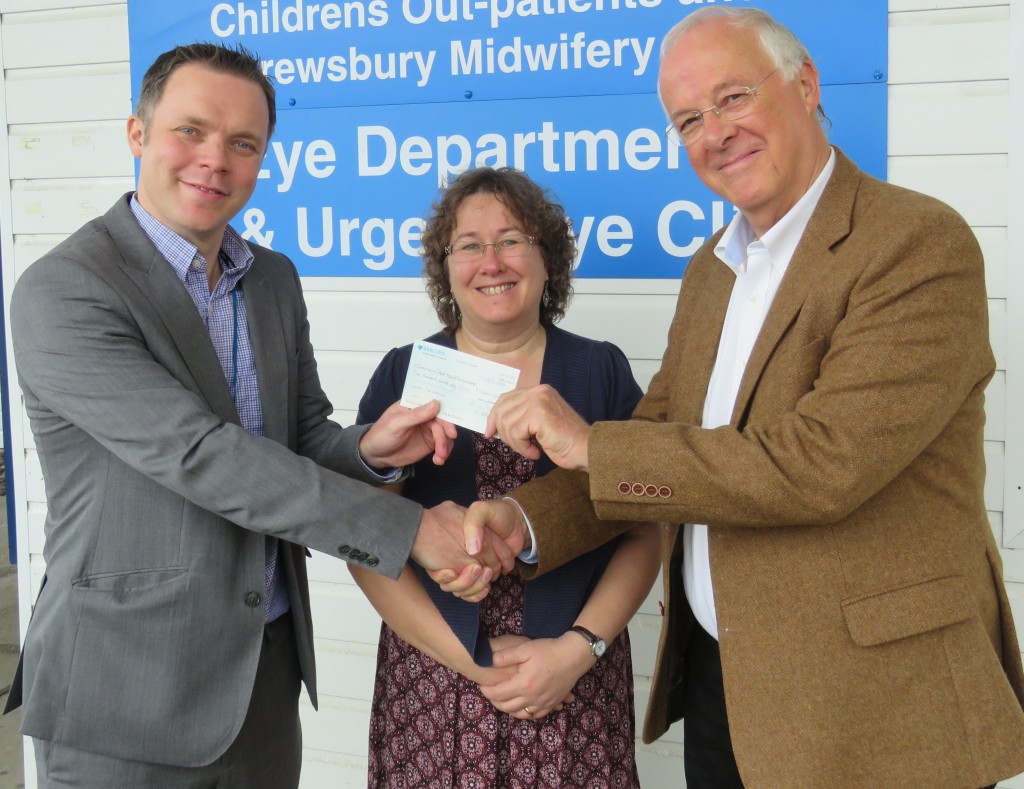 Andrew Evans receiving a cheque for £5000 from Clare Humphreys and Robin Durham of Sight Loss Shropshire