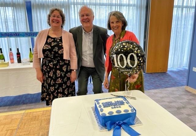 Sight Loss Shropshire’s Clare Humphreys, Secretary Robin Durham & Chairman Diana Flint with the centenary cake and balloon. Image courtesy of Border Counties Advertizer.