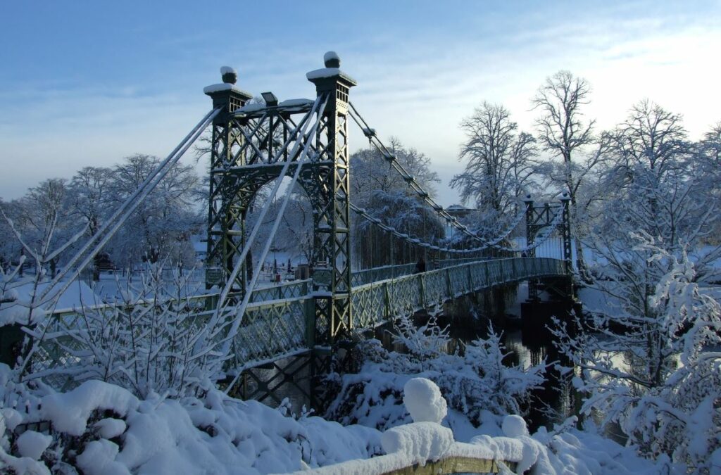 A photograph depicting Porthill Bridge in Shrewsbury covered in snow. © Sight Loss Shropshire
